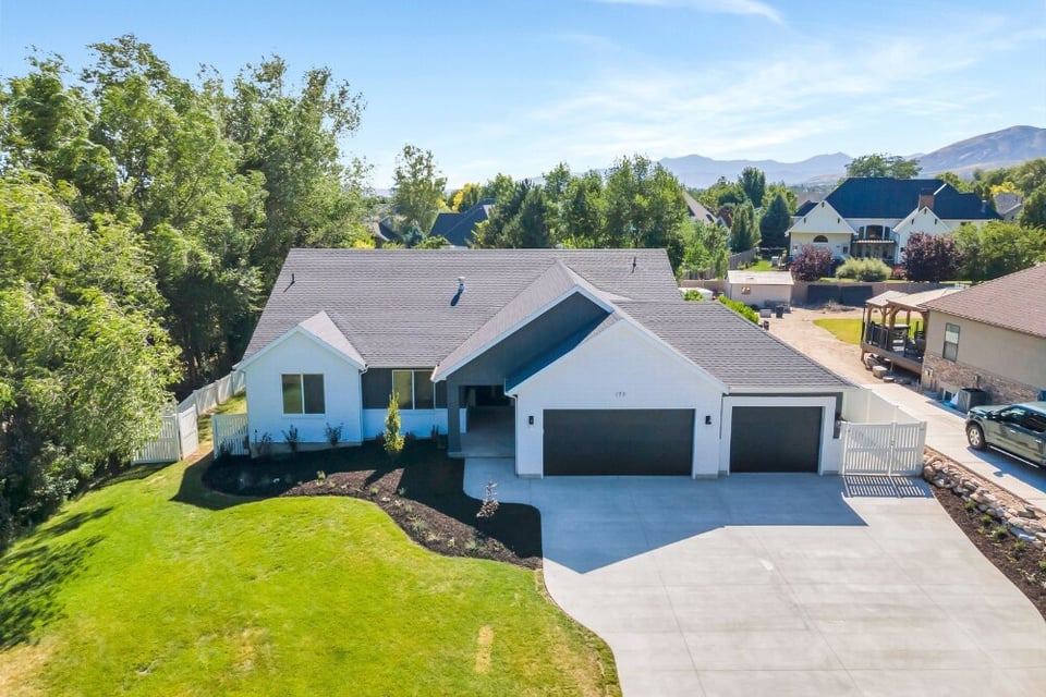 An exterior drone view of a custom home in Alpine, Utah. 