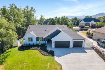 An exterior drone view of a custom home in Alpine, Utah. 