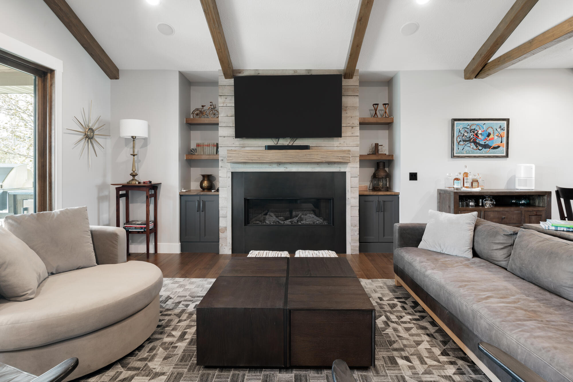 Custom living area with rustic finishes and clean modern styling by Conner Construction Company in Utah County