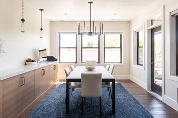 Stylish dining area remodel with chandelier in a Conner Construction home in Provo, Utah