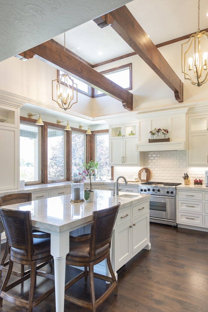 Vaulted custom kitchen with wood beams and pendant lighting by Conner Construction Company in Sundance, UT