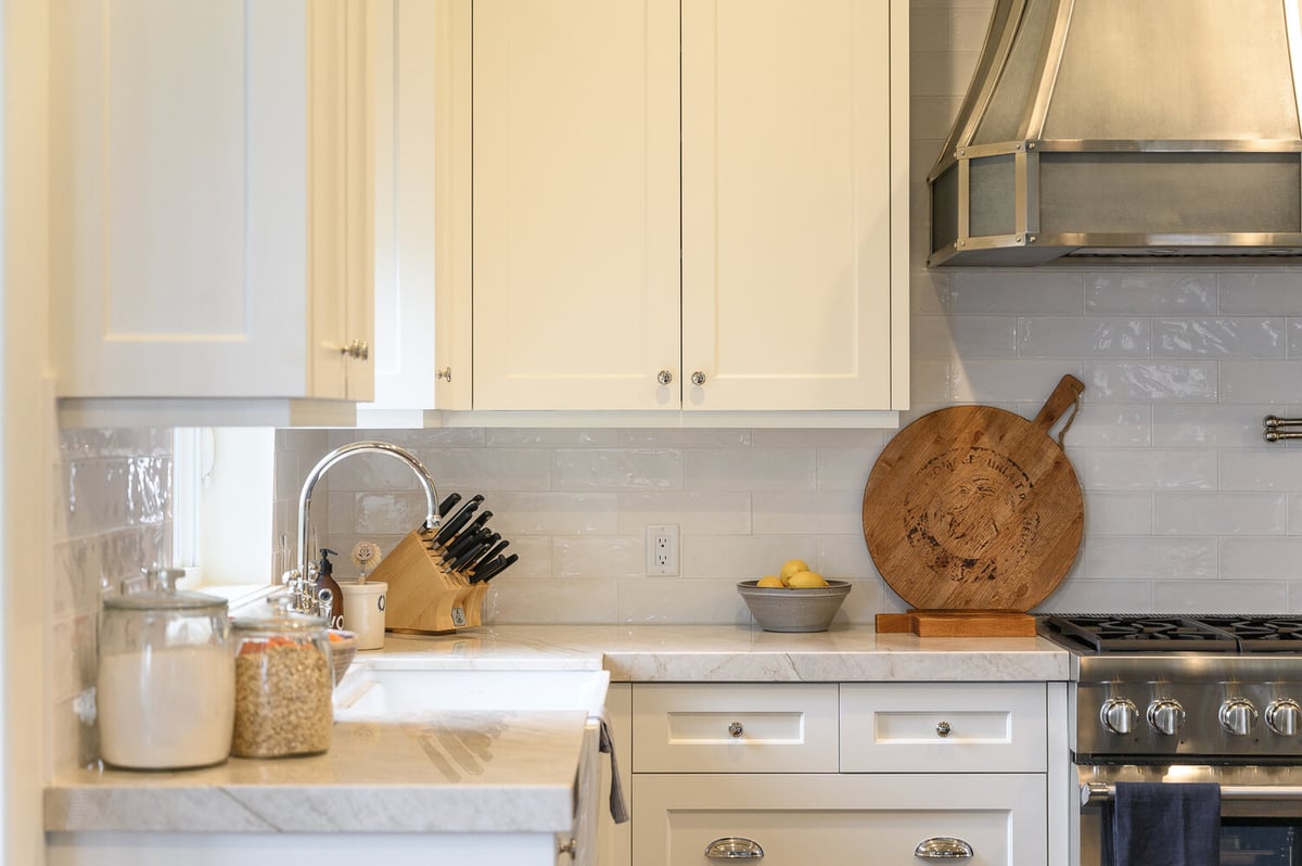 Clean and functional kitchen counter space with integrated knife block and modern finishes by Conner Construction Company in Utah