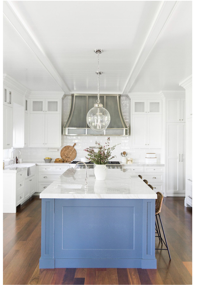 Custom Highland, UT kitchen remodel by Conner Construction Company featuring a blue island and statement range hood