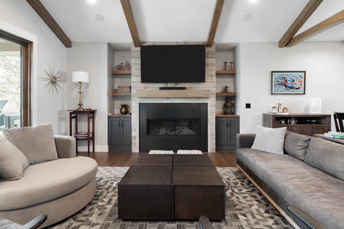 Custom living area with rustic finishes and clean modern styling by Conner Construction Company in Utah County