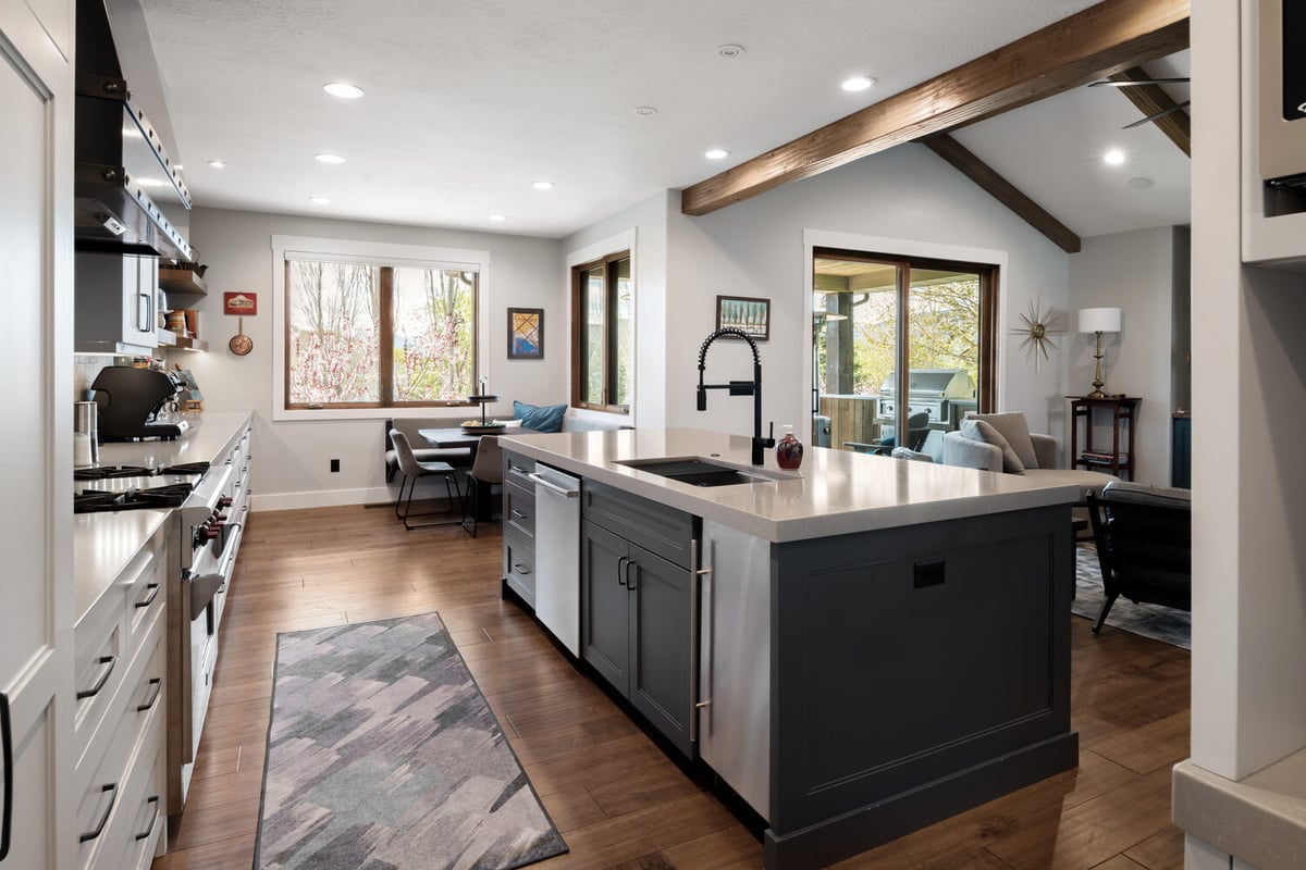 Functional kitchen remodel with quartz countertops and matte black hardware by Conner Construction Company in Utah County