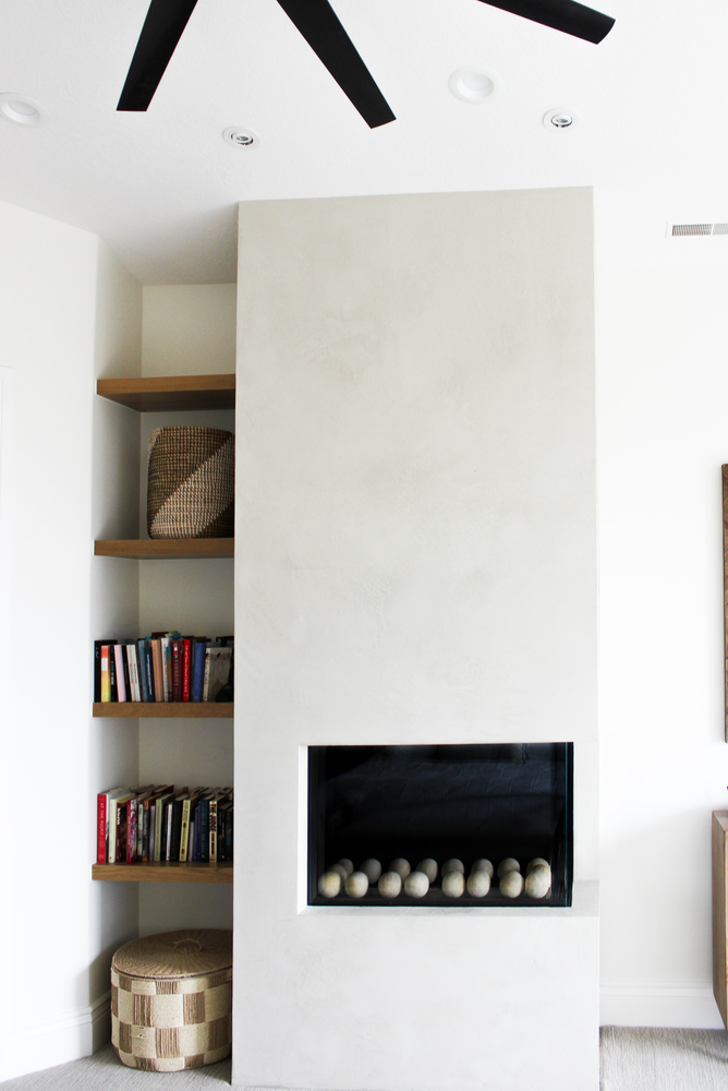 Built-in fireplace with modern stucco surround in custom home by Conner Construction Company in Provo, UT Built-in fireplace with modern stucco surround in custom home by Conner Construction Company in Provo, UT