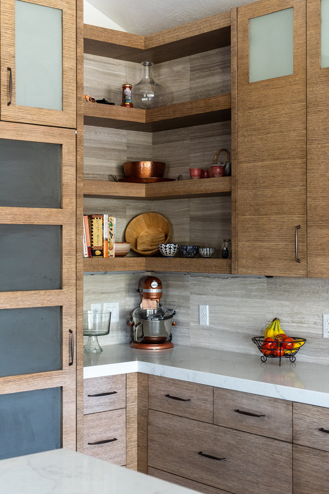 Built-in shelving and quartz countertops in a Conner Construction custom home kitchen in Midway, Utah