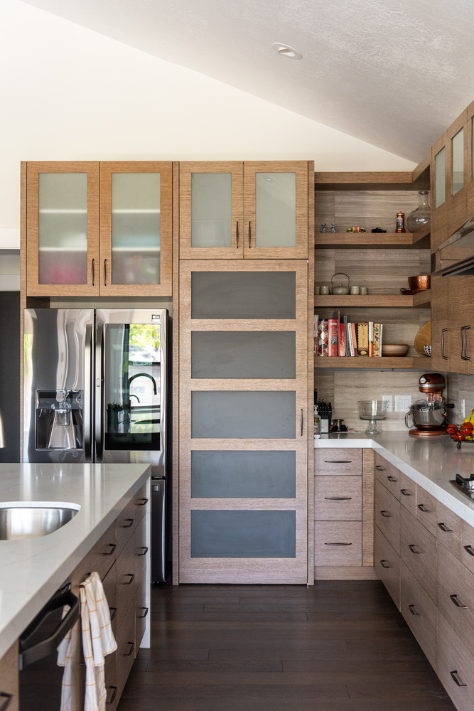 Custom pantry and stainless refrigerator in a Conner Construction kitchen in Park City, Utah