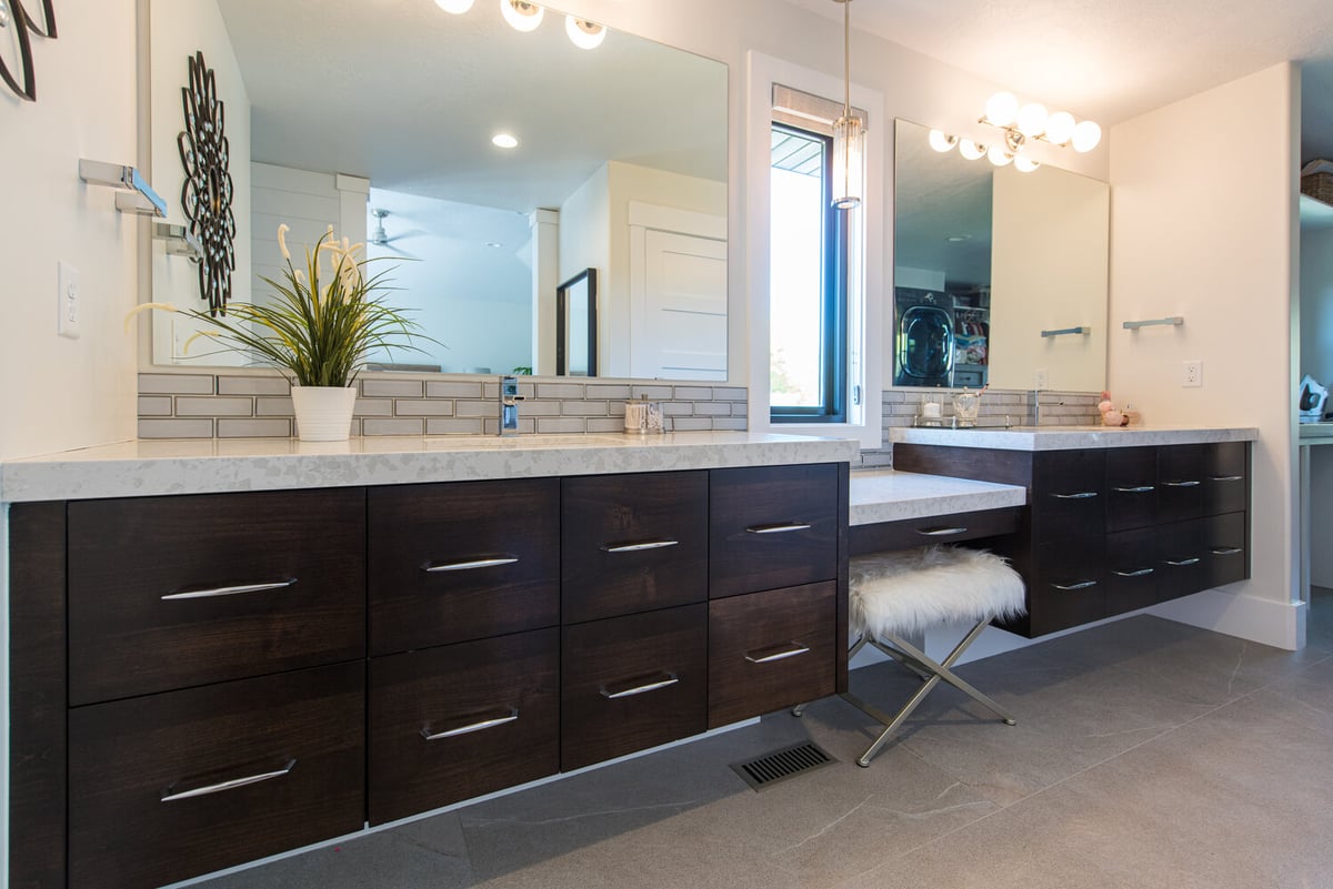 Double sink bathroom with modern dark cabinetry in a Conner Construction home in Park City, UT