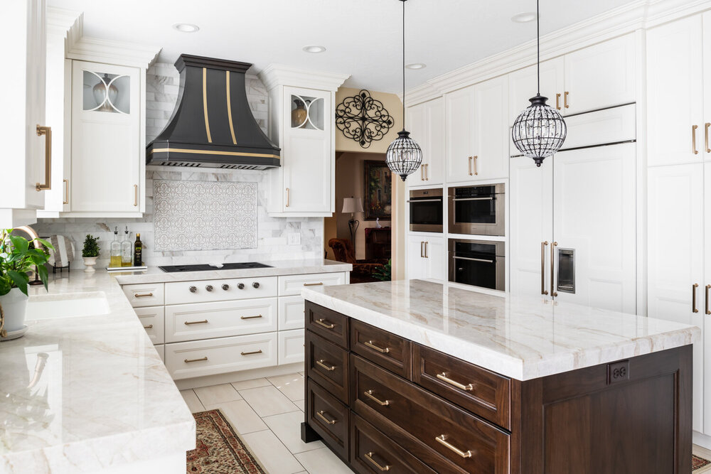 Custom white kitchen remodel with built-in appliances and wood island by Conner Construction Company in Highland, UT