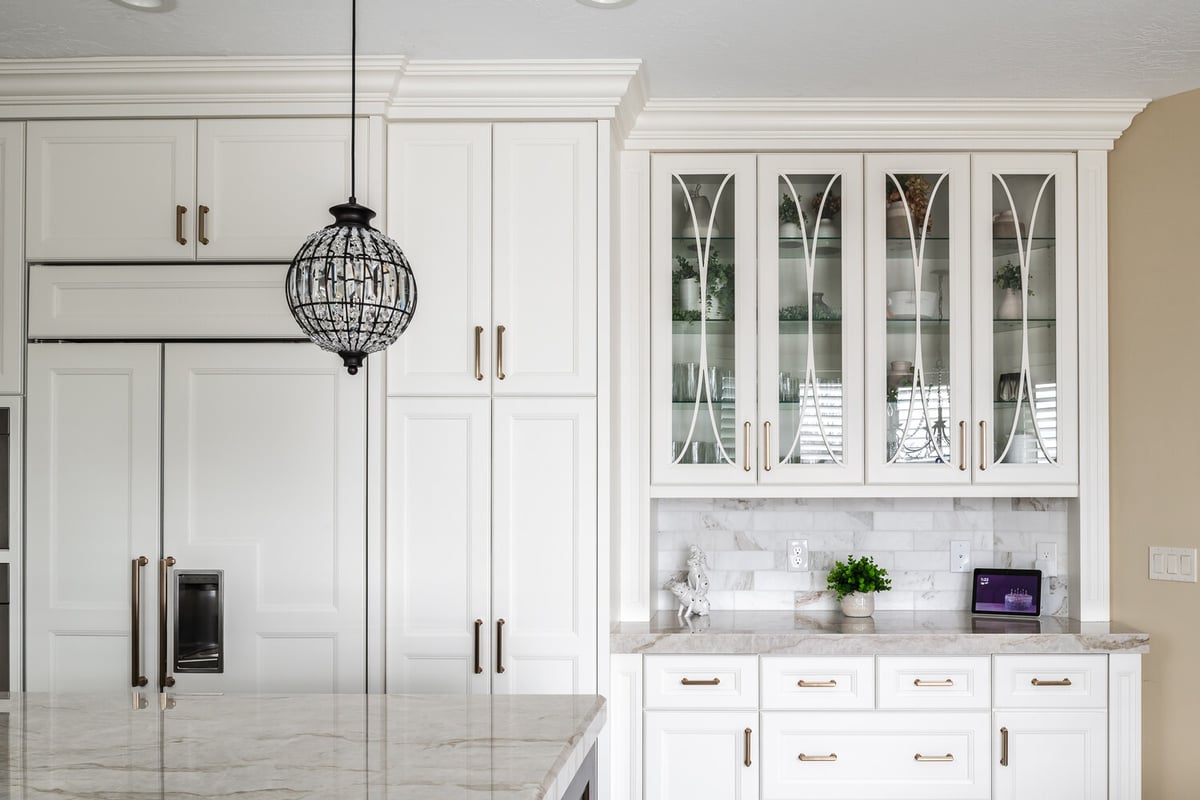 Elegant built-in cabinetry and marble counters in custom kitchen by Conner Construction Company in Highland, UT