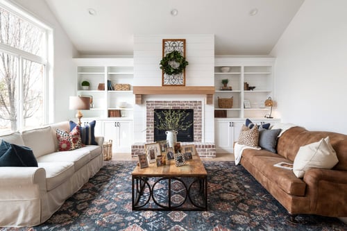 Light-filled traditional living space with shiplap accents and cozy seating by Conner Construction Company in Utah County
