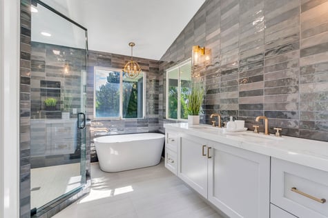 Spa-like bathroom with glass shower, soaking tub, and dual sinks in a Conner Construction Company home in Saratoga Springs, UT