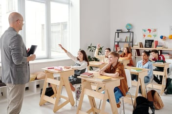 A teacher instructing students in class in a Utah County school