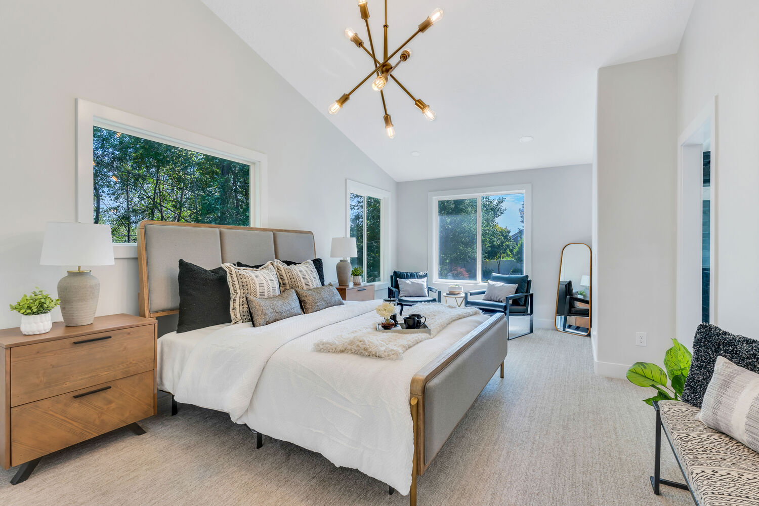 Master bedroom in Utah County custom home by Conner Construction Company with natural light and neutral palette