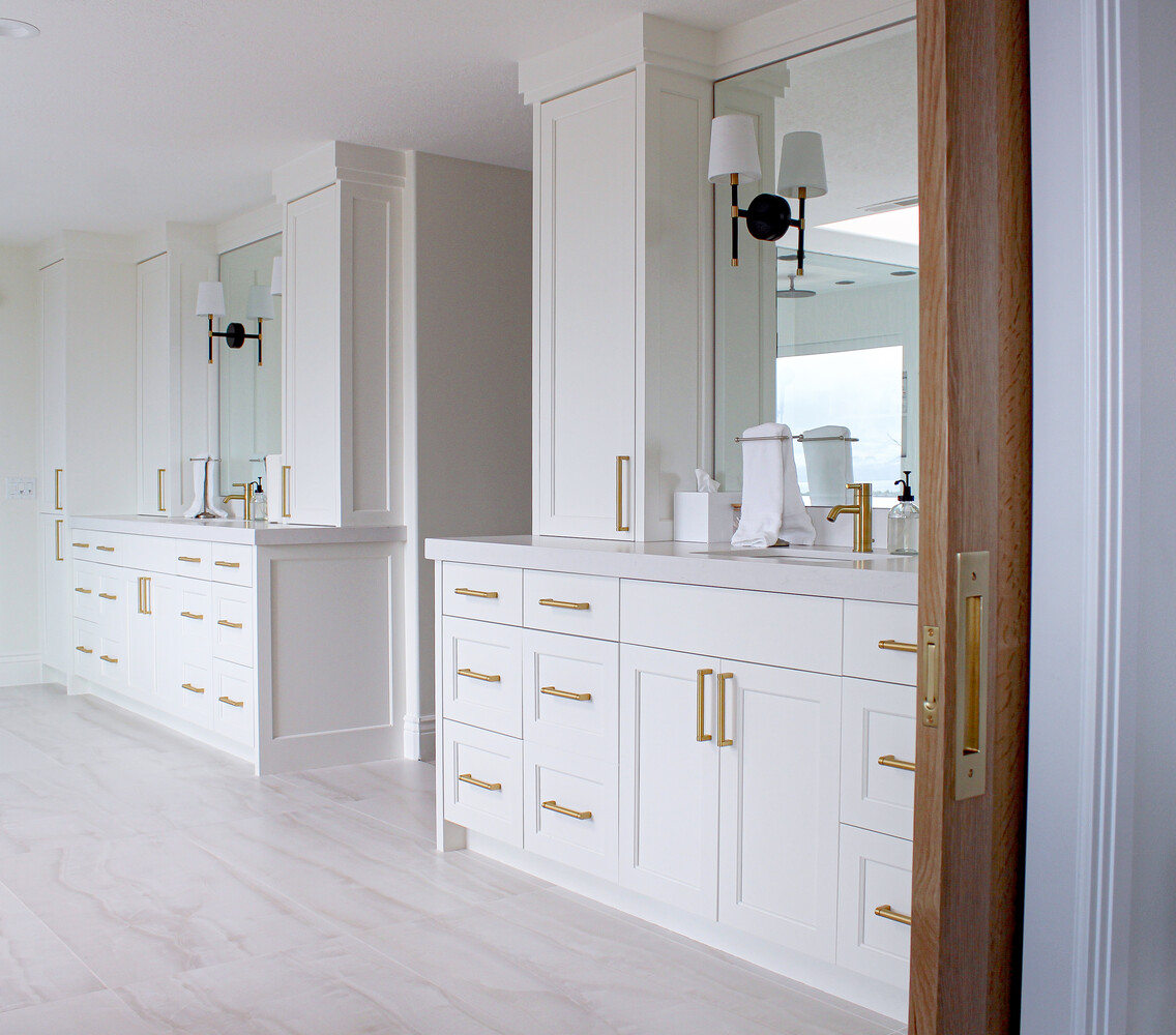 Luxury double vanity bathroom with white cabinetry and gold hardware by Conner Construction Company in Park City, UT