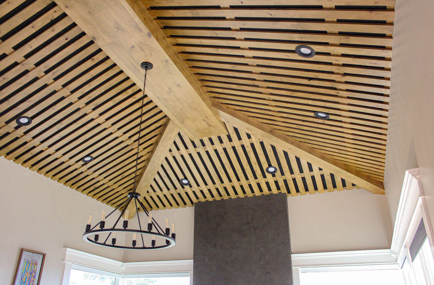 Unique wood beam ceiling with recessed lighting in a Heber, UT custom home by Conner Construction Company