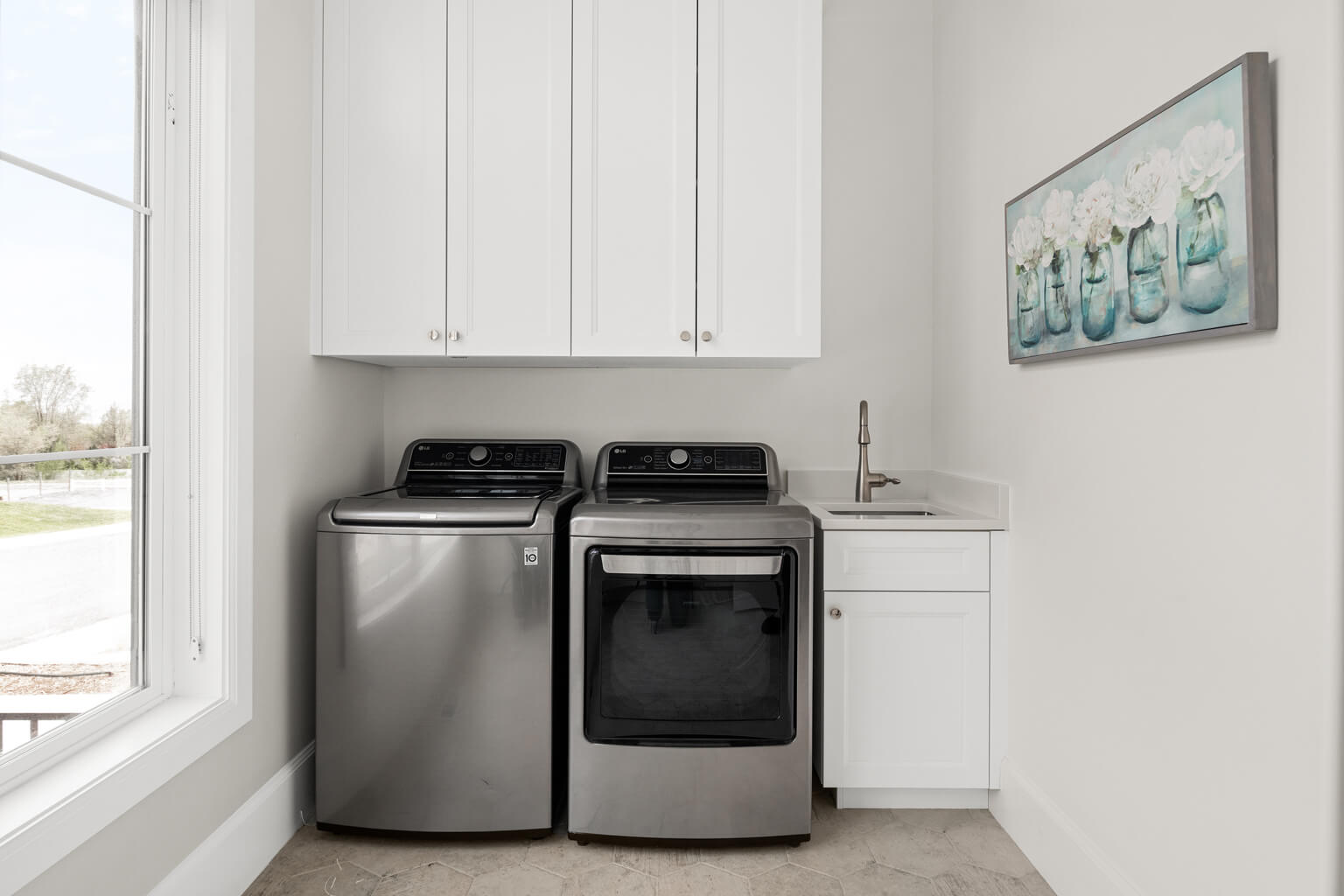 A laundry room with a washer and dryer