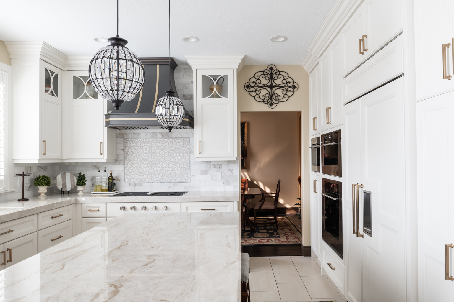 Utah custom home builders create a stunning kitchen with sleek finishes and functional layout.