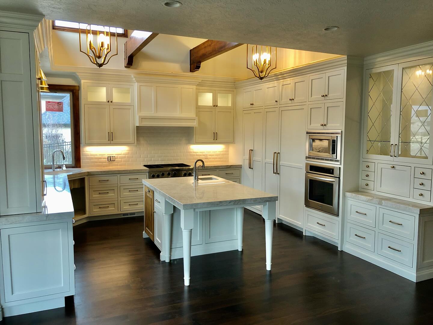 Kitchen with white cabinets and center island